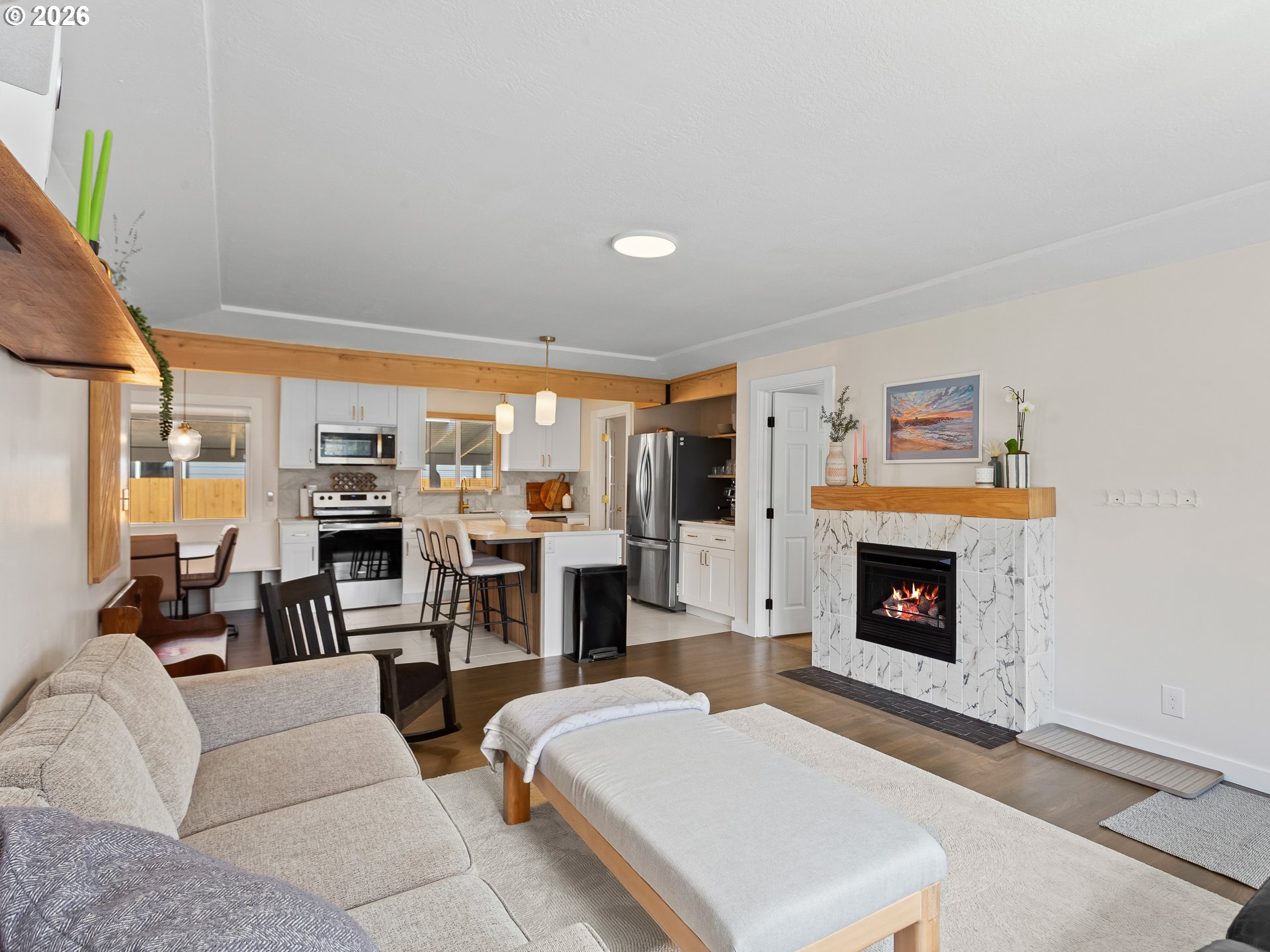 20149 Northeast Oregon Street Fairview, OR 97024 - Photo 5 of 37 a living room with furniture a fireplace and a flat screen tv