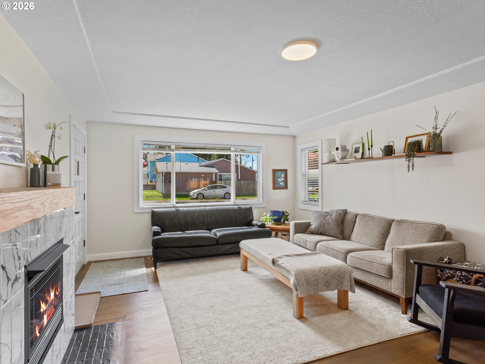 20149 Northeast Oregon Street Fairview, OR 97024 - Photo 9 of 37 a living room with furniture and a fireplace