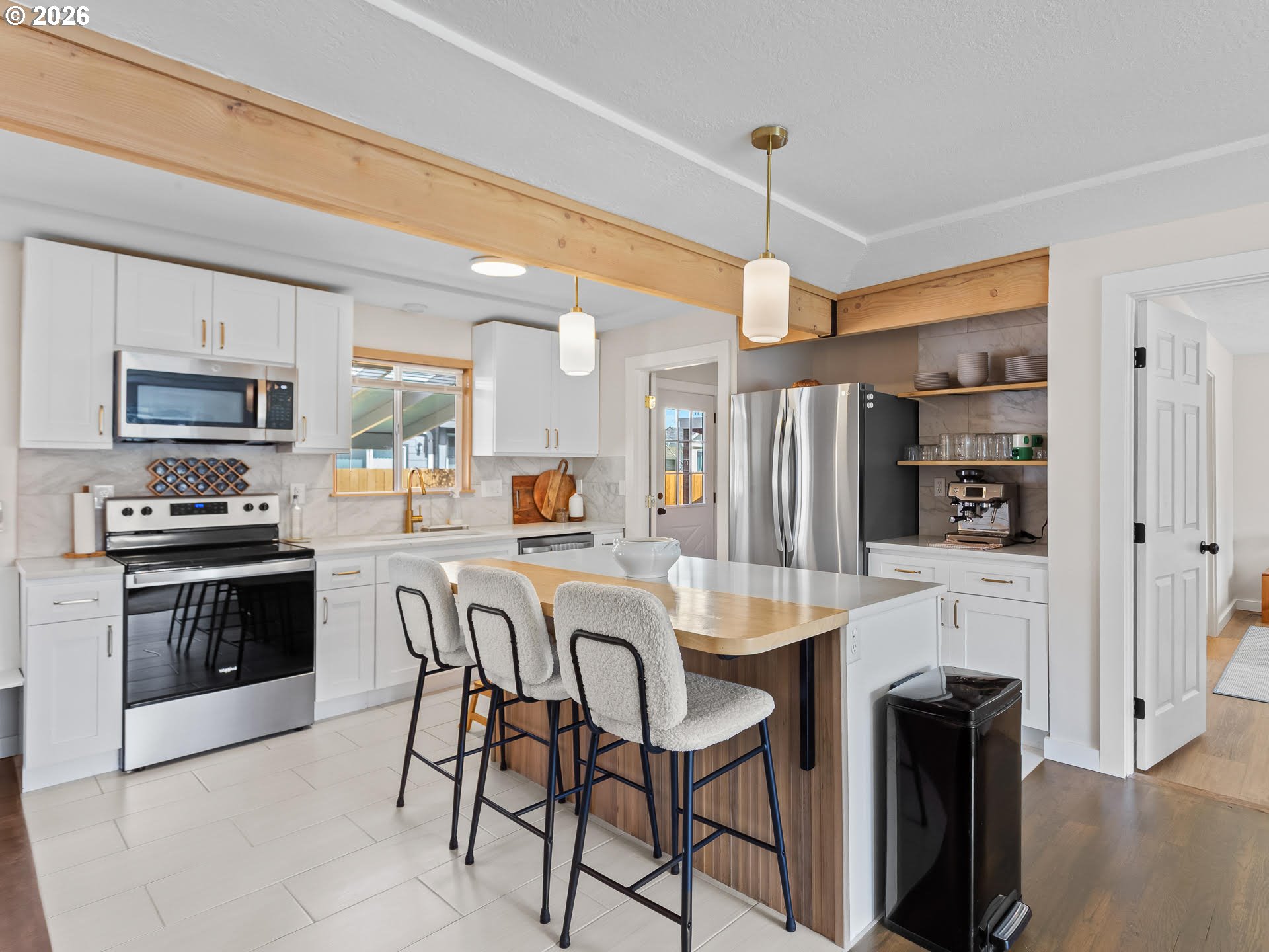 20149 Northeast Oregon Street Fairview, OR 97024 - Photo 10 of 37 a kitchen with stainless steel appliances granite countertop a stove refrigerator and a sink