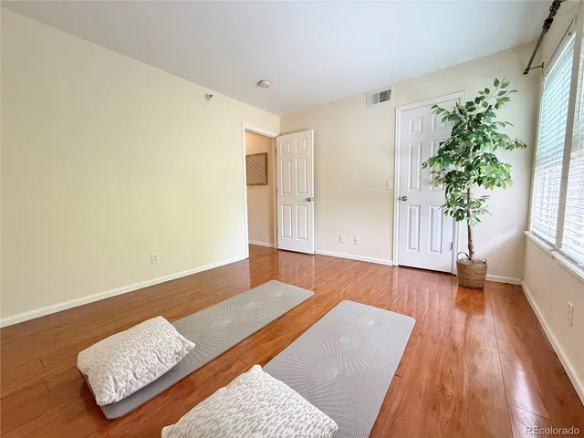 a view of an empty room and wooden floor