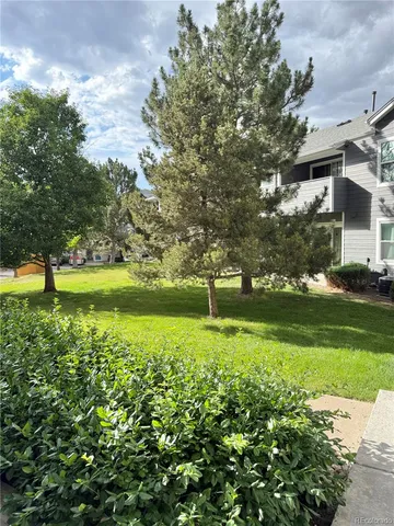 a view of a golf course with a lake