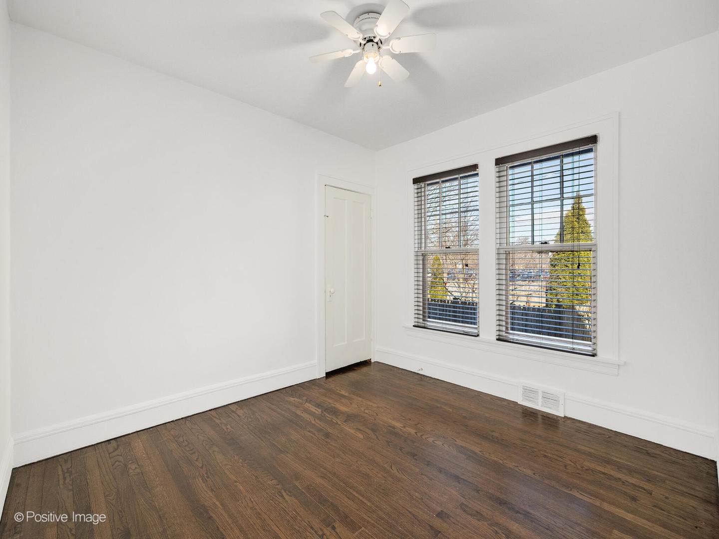 108 South Park Road La Grange, IL 60525 - Photo 13 of 20 a view of an empty room with wooden floor and a window