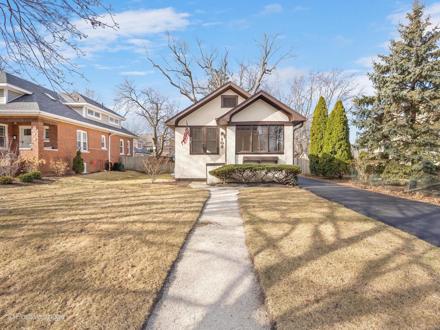 108 South Park Road La Grange, IL 60525 - Photo 3 of 20 a front view of a house with a yard