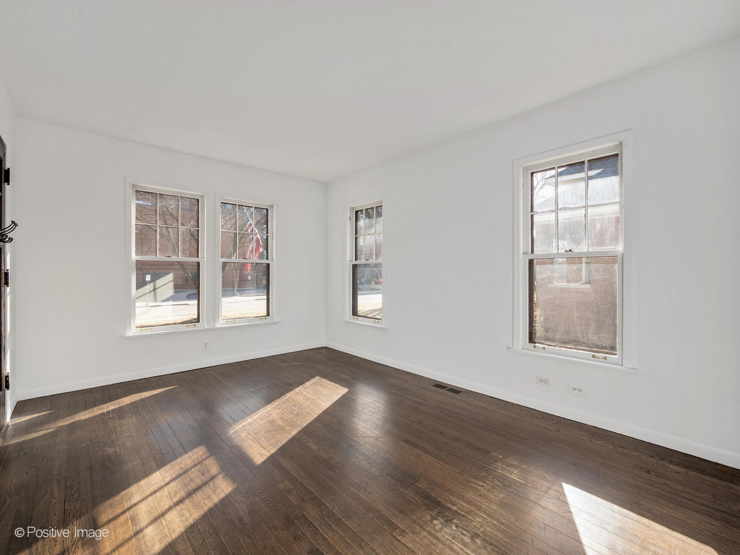 108 South Park Road La Grange, IL 60525 - Photo 5 of 20 a view of an empty room with wooden floor and a window