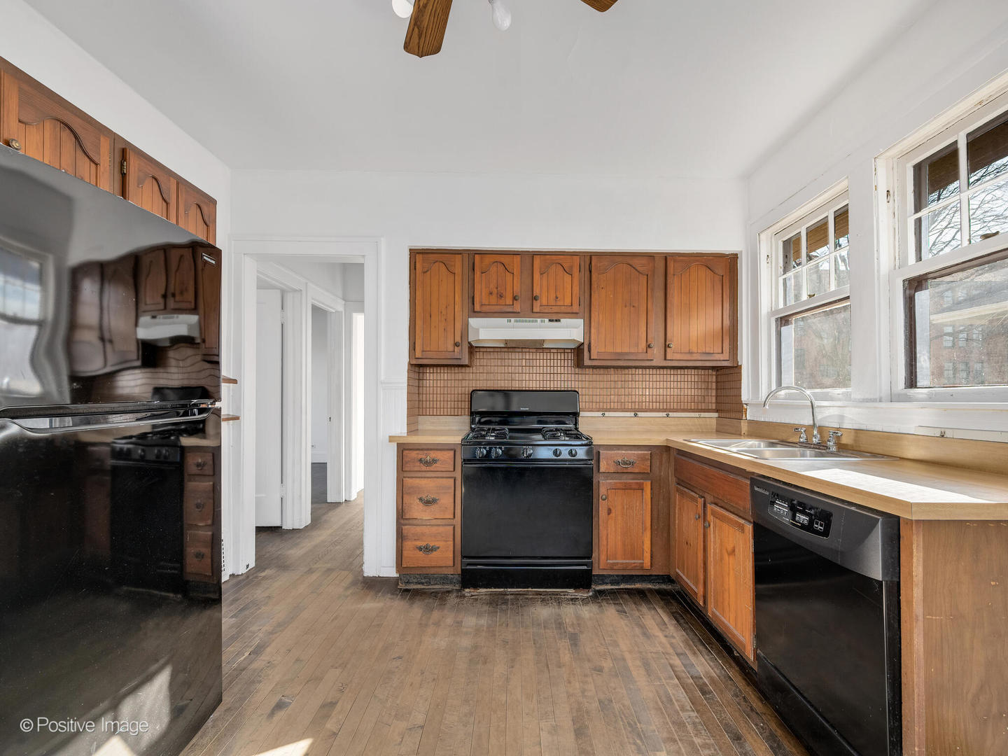 108 South Park Road La Grange, IL 60525 - Photo 7 of 20 a kitchen with stainless steel appliances granite countertop a stove a sink and a refrigerator