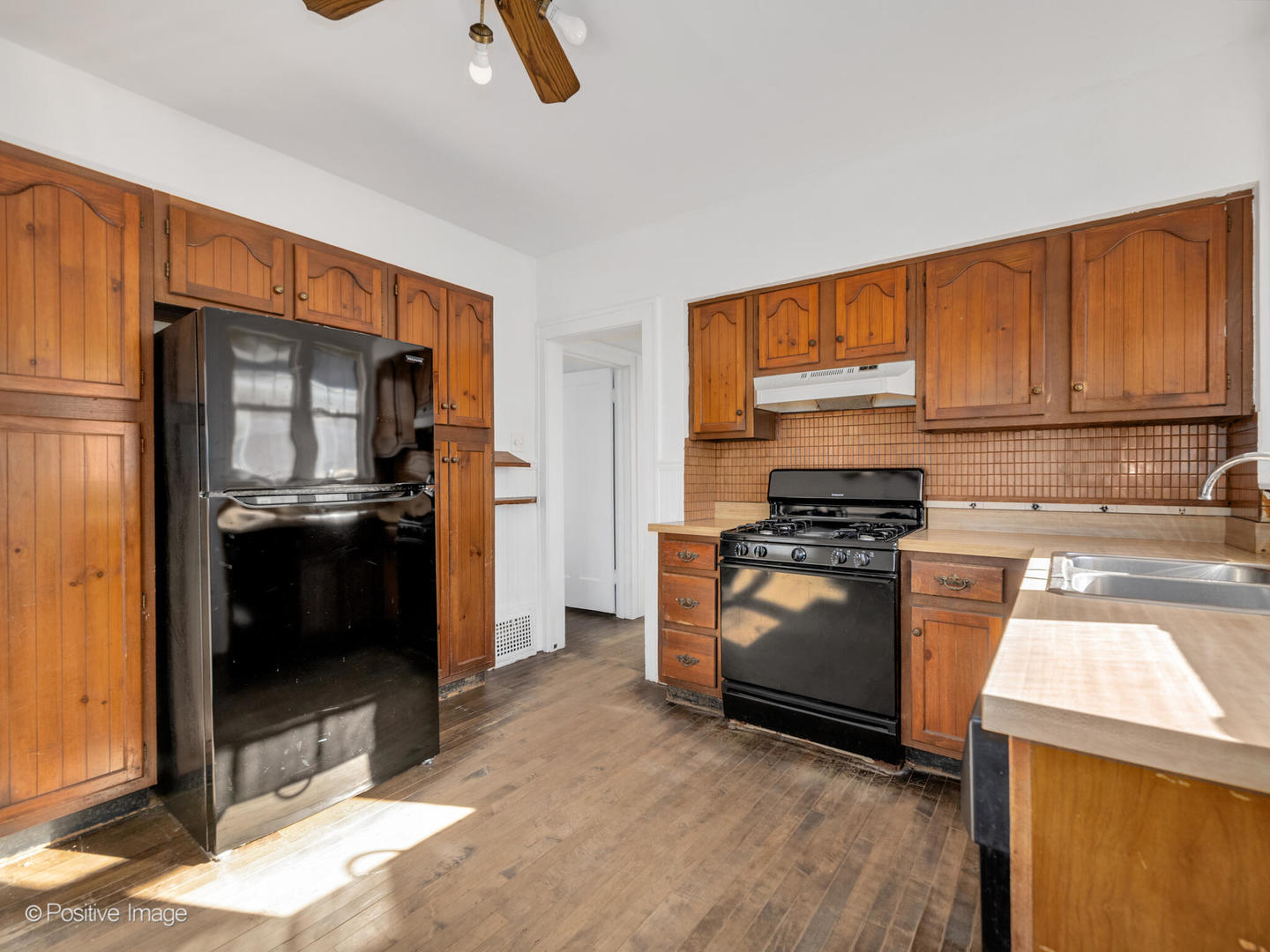 108 South Park Road La Grange, IL 60525 - Photo 8 of 20 a kitchen with granite countertop a refrigerator and a stove top oven
