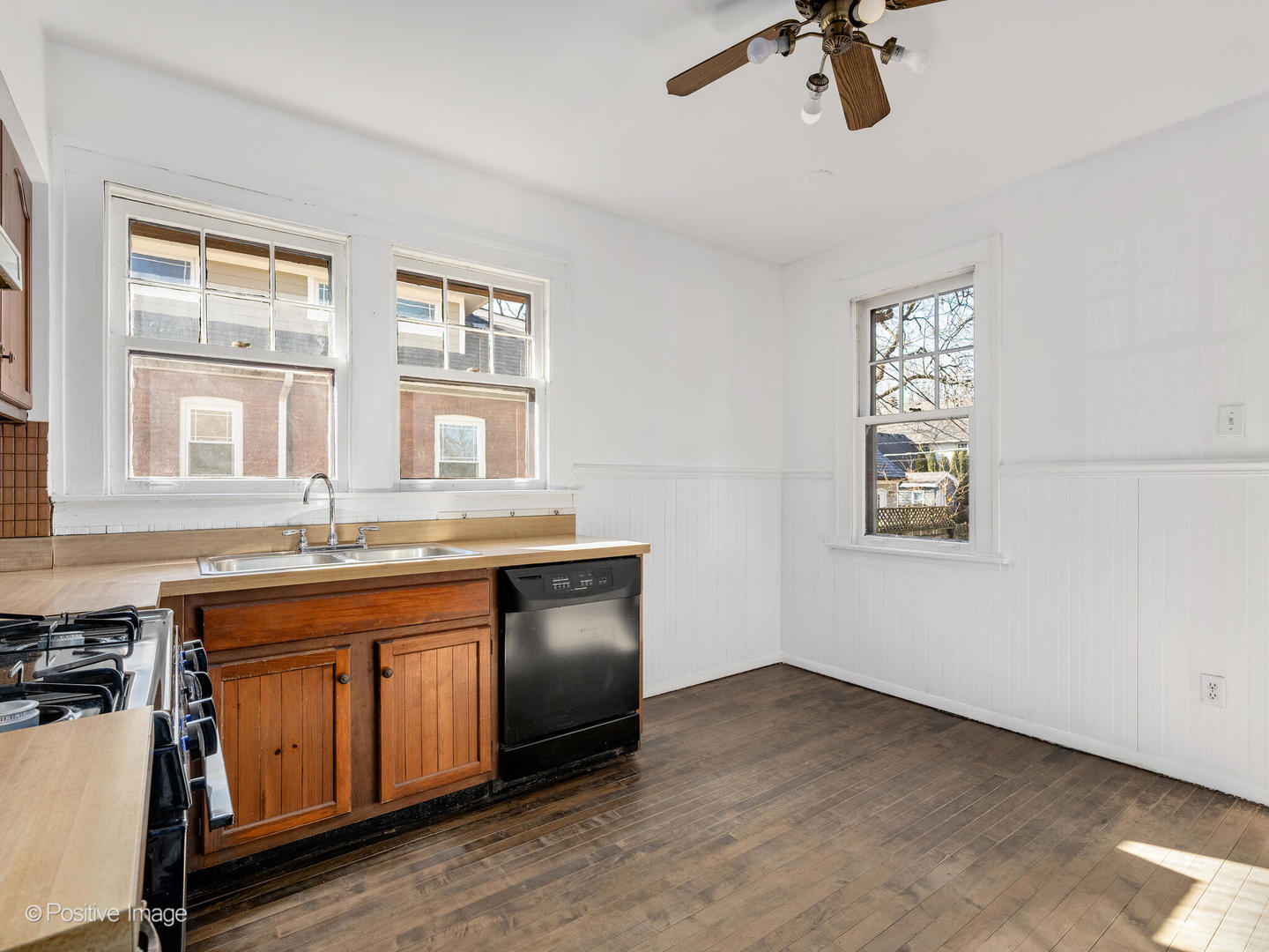 108 South Park Road La Grange, IL 60525 - Photo 9 of 20 a kitchen with granite countertop a sink cabinets stainless steel appliances and a window