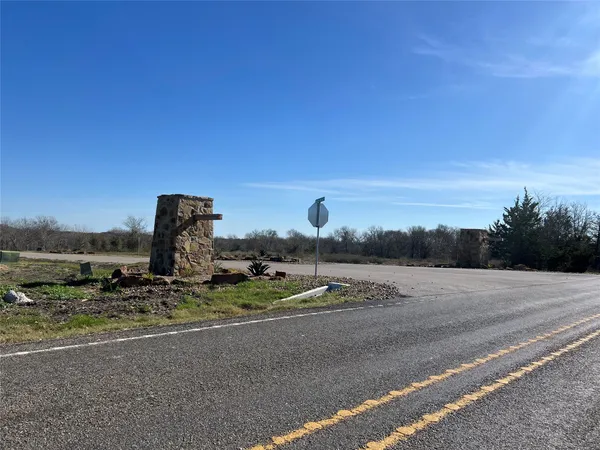 a view of a road with a building in the background