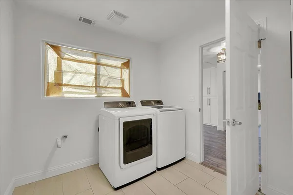 a utility room with dryer and washer