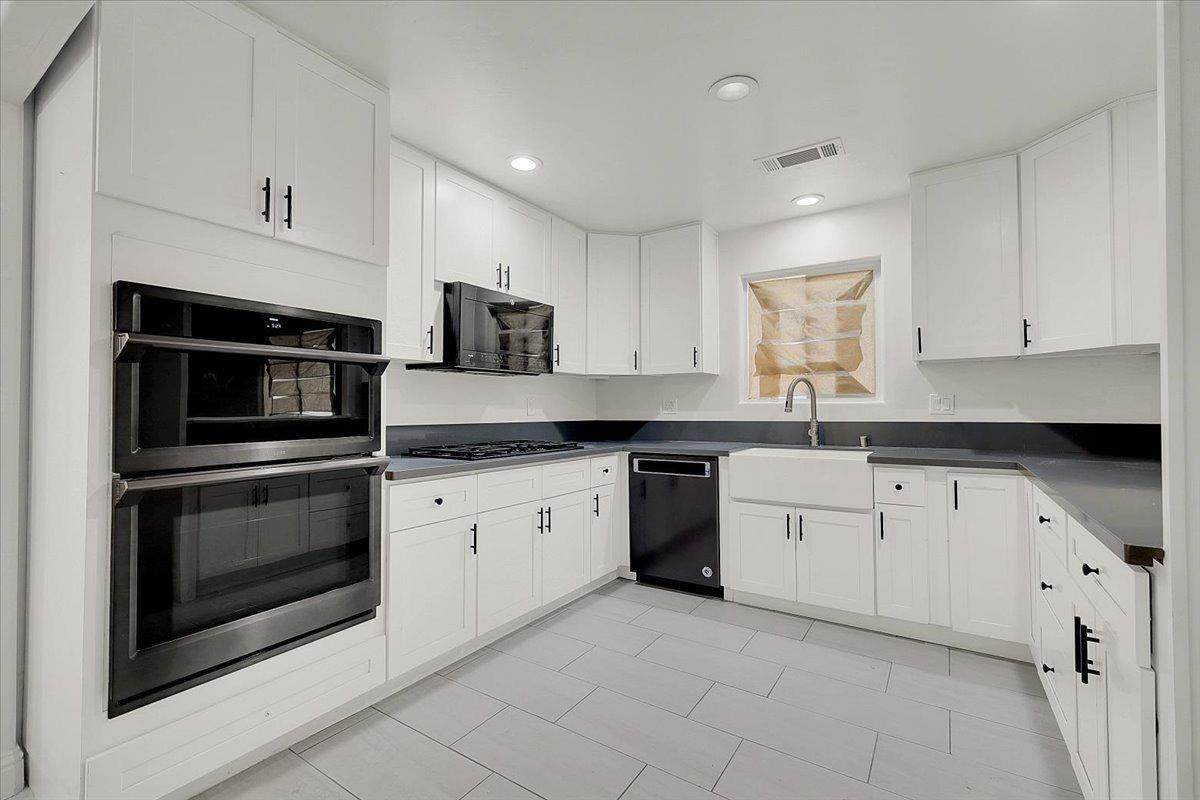 2473 Date Street Live Oak, CA 95953 - Photo 12 of 27 a kitchen with granite countertop white cabinets white stainless steel appliances with a sink and dishwasher