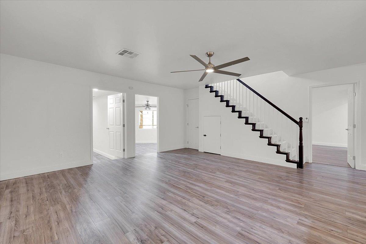 2473 Date Street Live Oak, CA 95953 - Photo 15 of 27 a view of an empty room with wooden floor and stairs