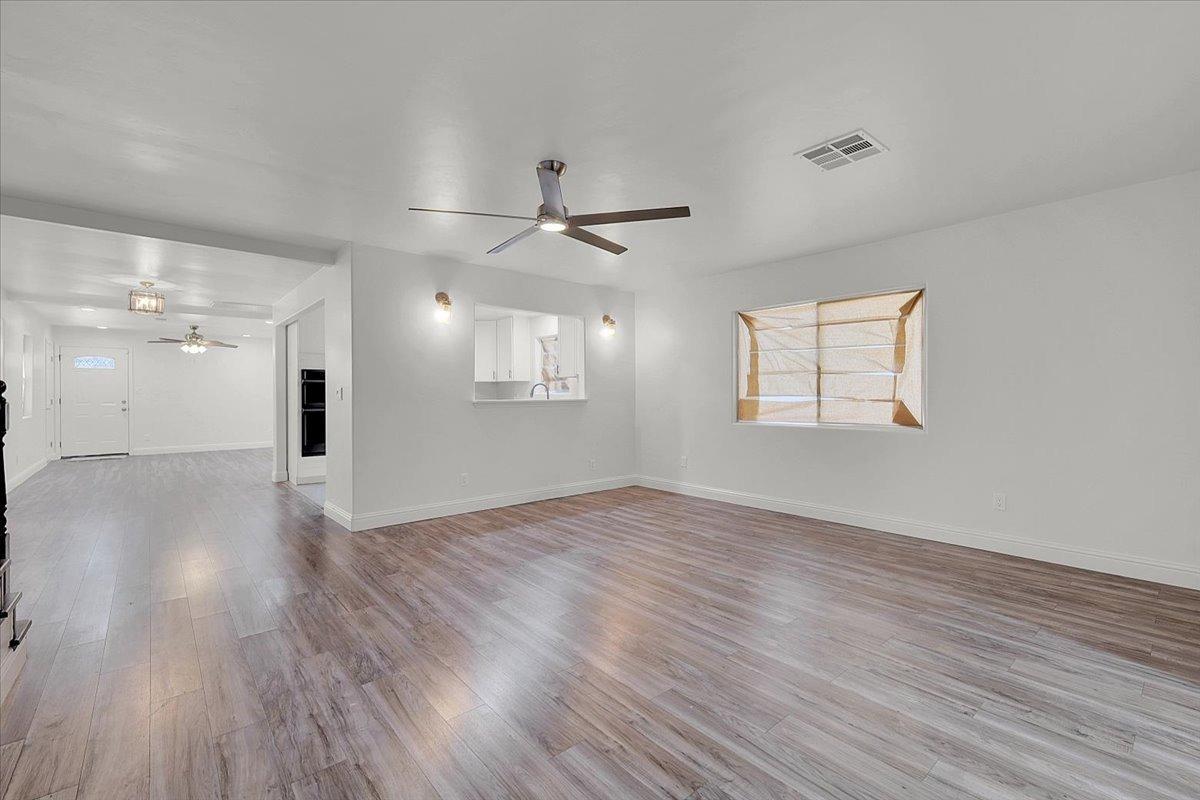 2473 Date Street Live Oak, CA 95953 - Photo 17 of 27 wooden floor in an empty room with a window