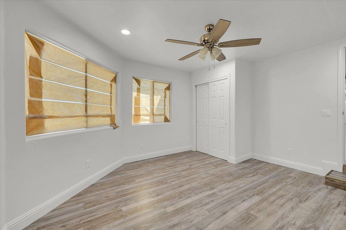 2473 Date Street Live Oak, CA 95953 - Photo 19 of 27 a view of empty room with wooden floor and fan