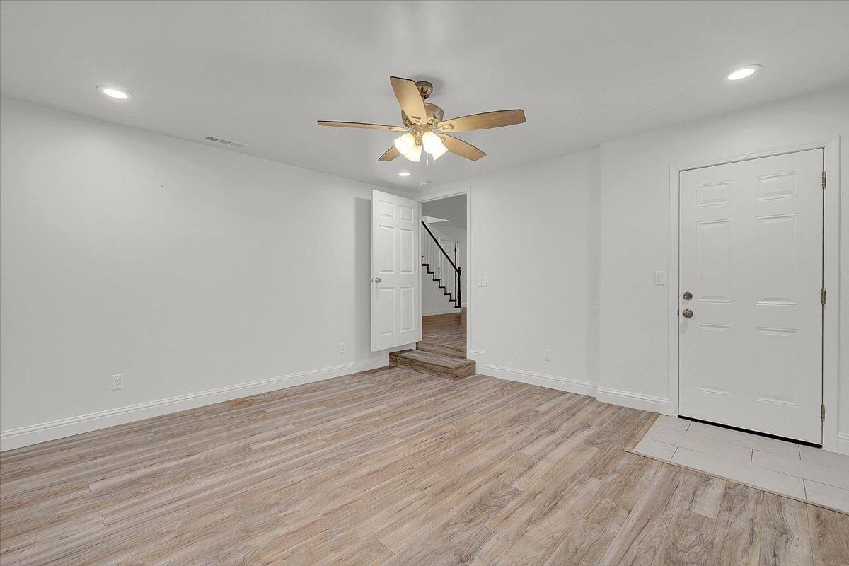 2473 Date Street Live Oak, CA 95953 - Photo 21 of 27 wooden floor in an empty room with a fan