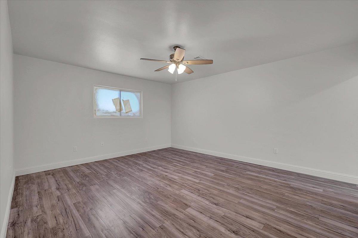 2473 Date Street Live Oak, CA 95953 - Photo 22 of 27 wooden floor in an empty room with a window