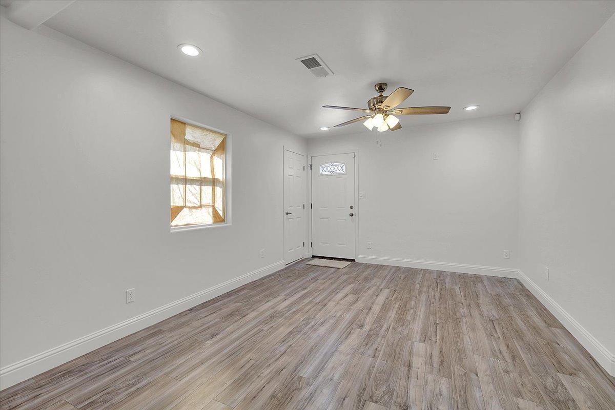 2473 Date Street Live Oak, CA 95953 - Photo 6 of 27 wooden floor in an empty room with a window