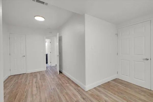 a view of a livingroom with wooden floor