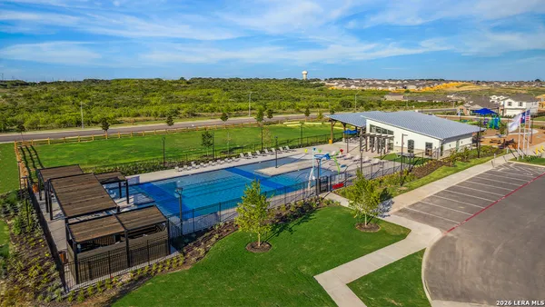 a view of a swimming pool with a patio