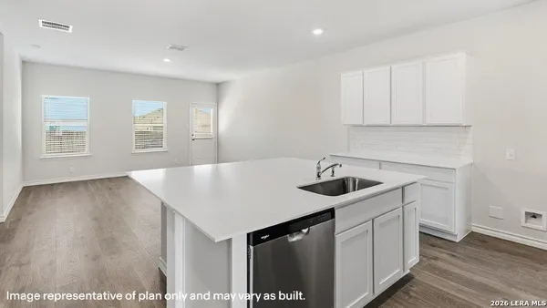 a en suite bathroom with a sink and a mirror