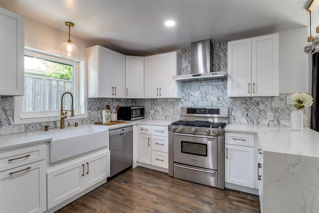 7127 East Mockingbird Lane Dallas, TX 75214 - Photo 12 of 31 a kitchen with white cabinets appliances and sink