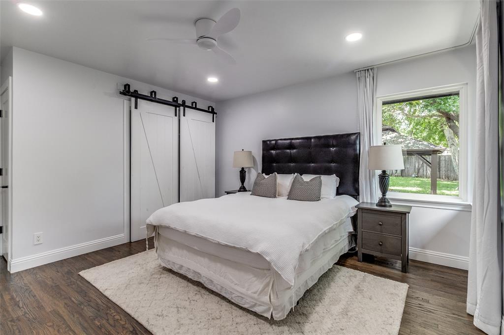 7127 East Mockingbird Lane Dallas, TX 75214 - Photo 16 of 31 a large bedroom with a bed and a window