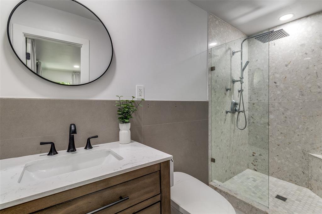 7127 East Mockingbird Lane Dallas, TX 75214 - Photo 17 of 31 a bathroom with a sink a toilet and shower