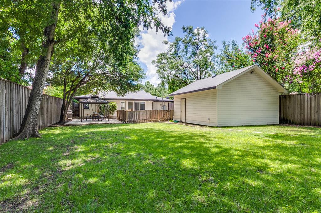 7127 East Mockingbird Lane Dallas, TX 75214 - Photo 22 of 31 a view of a house with backyard and garden