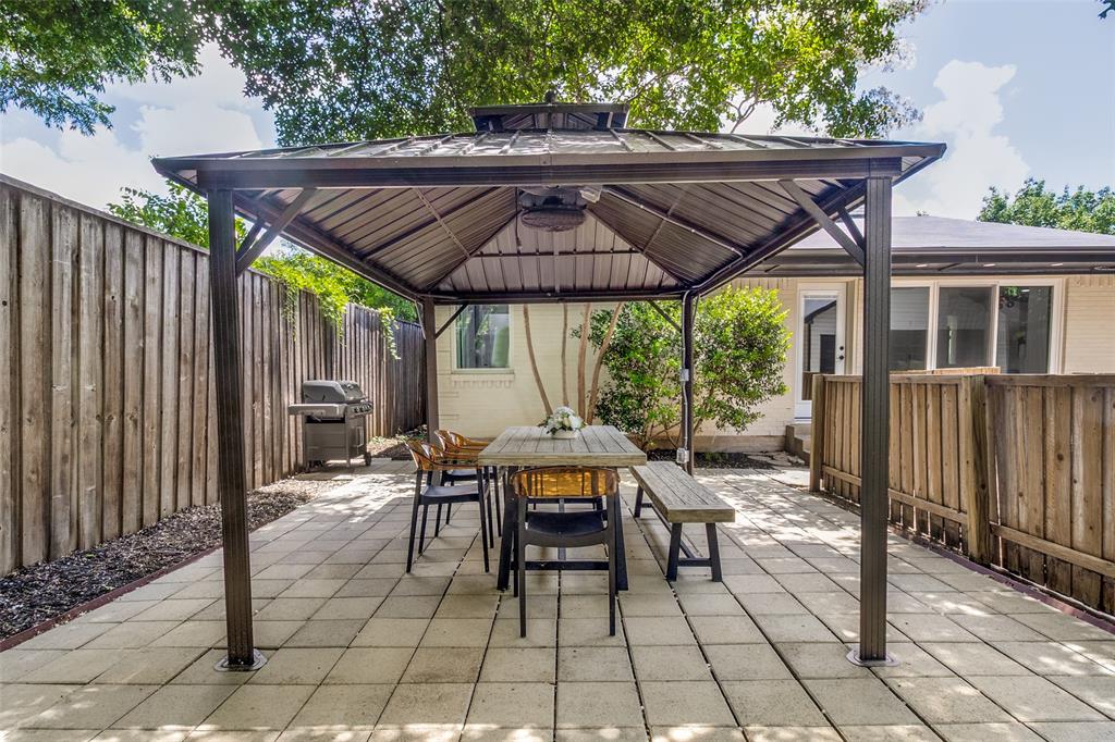 7127 East Mockingbird Lane Dallas, TX 75214 - Photo 24 of 31 a patio with glass top table and chairs