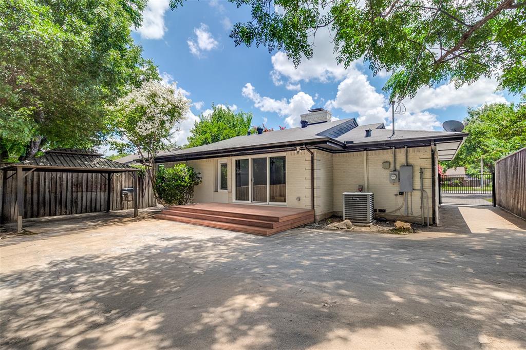 7127 East Mockingbird Lane Dallas, TX 75214 - Photo 31 of 31 a front view of a house with garden