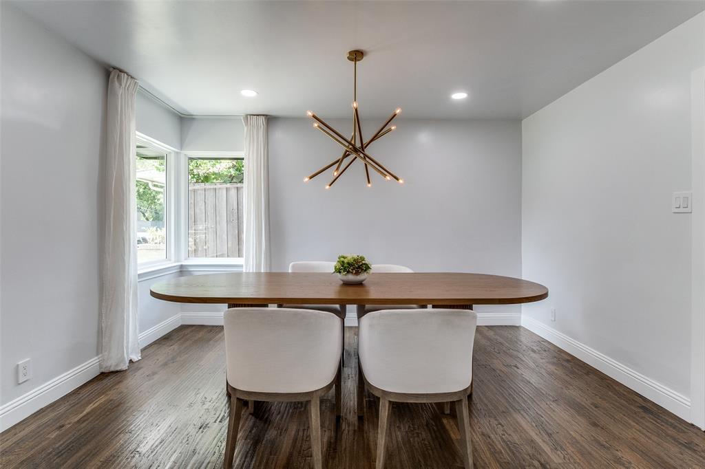 7127 East Mockingbird Lane Dallas, TX 75214 - Photo 7 of 31 a view of a dining room with furniture and wooden floor
