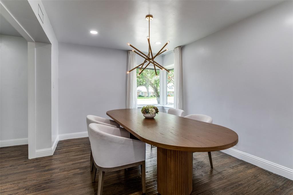 7127 East Mockingbird Lane Dallas, TX 75214 - Photo 8 of 31 a view of table and chair in wooden floor
