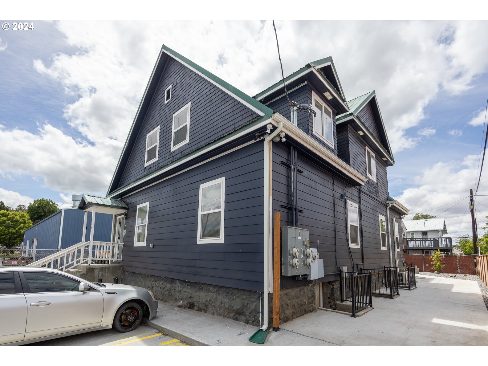 415 Southwest 7th Street Pendleton, OR 97801 - Photo 2 of 44 a car parked in front of a house