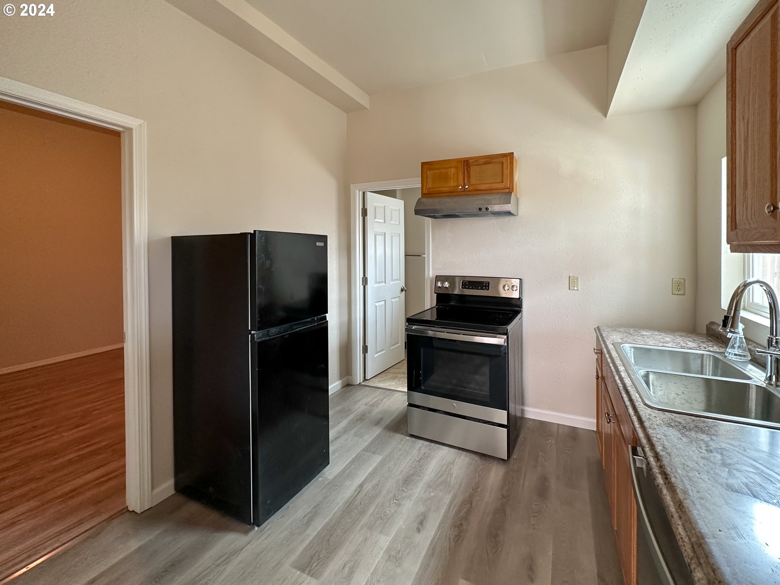 415 Southwest 7th Street Pendleton, OR 97801 - Photo 21 of 44 a kitchen with a refrigerator and a sink
