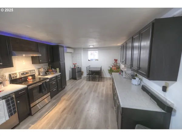 a kitchen with stainless steel appliances granite countertop a sink and cabinets