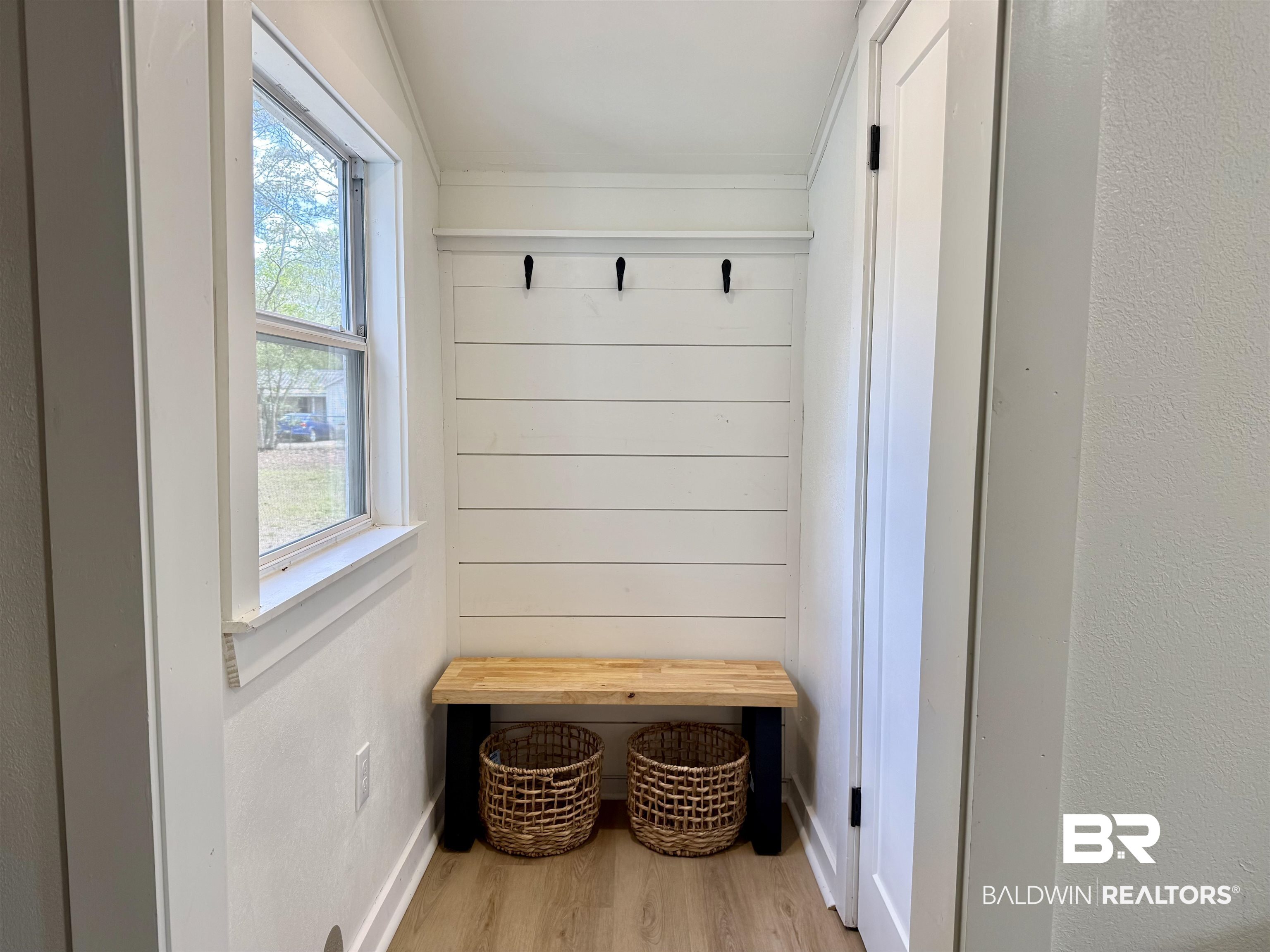 107 Dawson Street Brewton, AL 36426 - Photo 10 of 15 Mudroom with light wood-style floors and wood walls