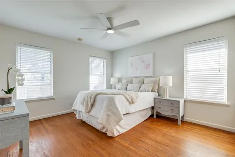 a spacious bedroom with a bed and a window