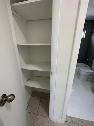 an empty room with a bench