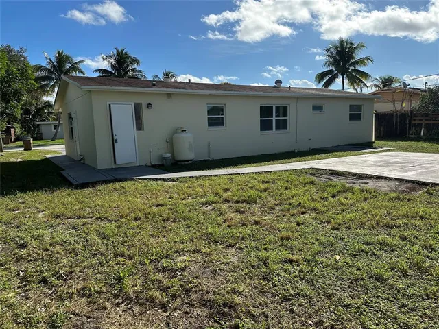 a view of a backyard of the house
