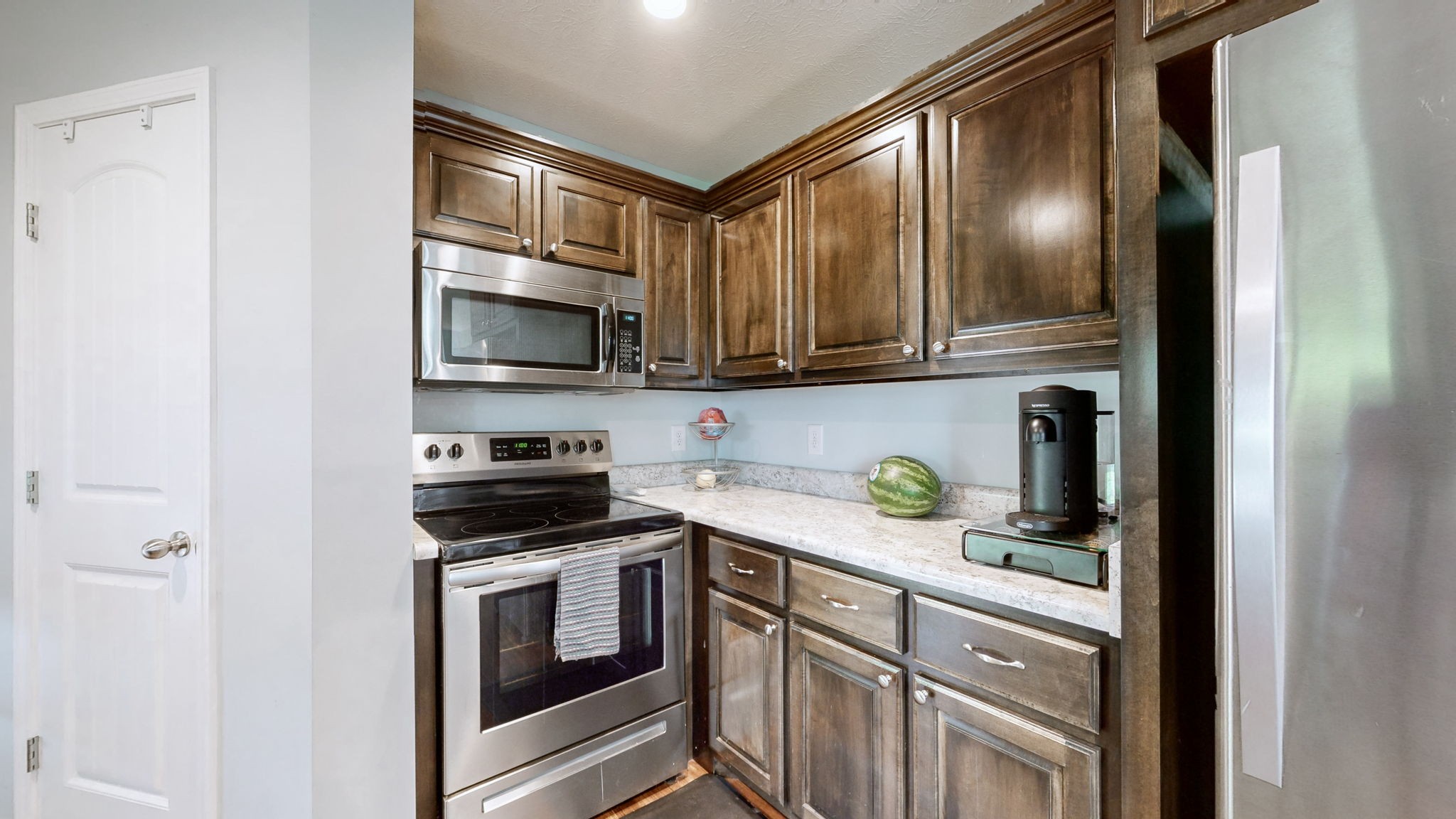 1462 East Ab Wade Road Portland, TN 37148 - Photo 14 of 52 a kitchen with stainless steel appliances granite countertop a refrigerator a stove a sink and cabinets
