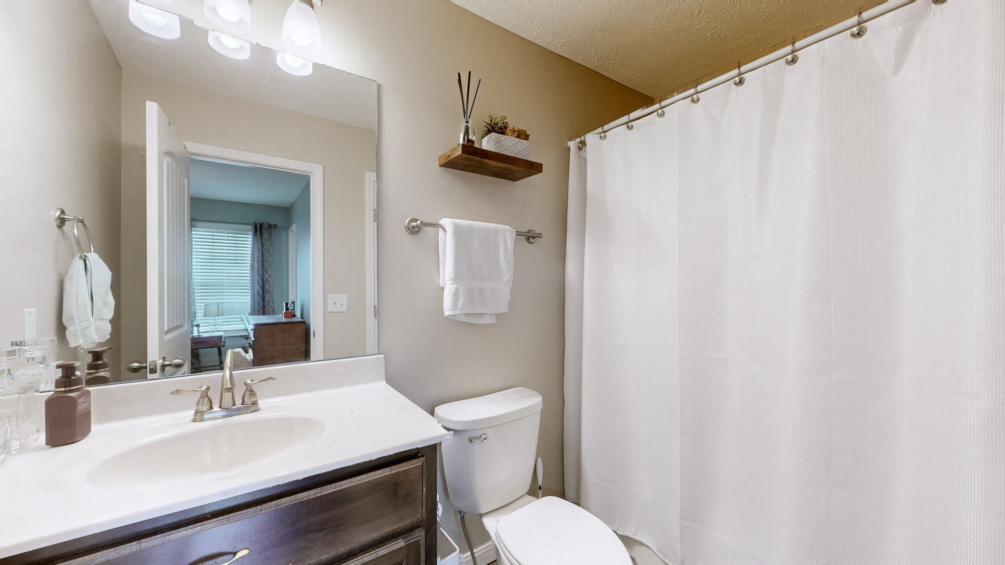 1462 East Ab Wade Road Portland, TN 37148 - Photo 20 of 52 a bathroom with a sink vanity mirror and toilet
