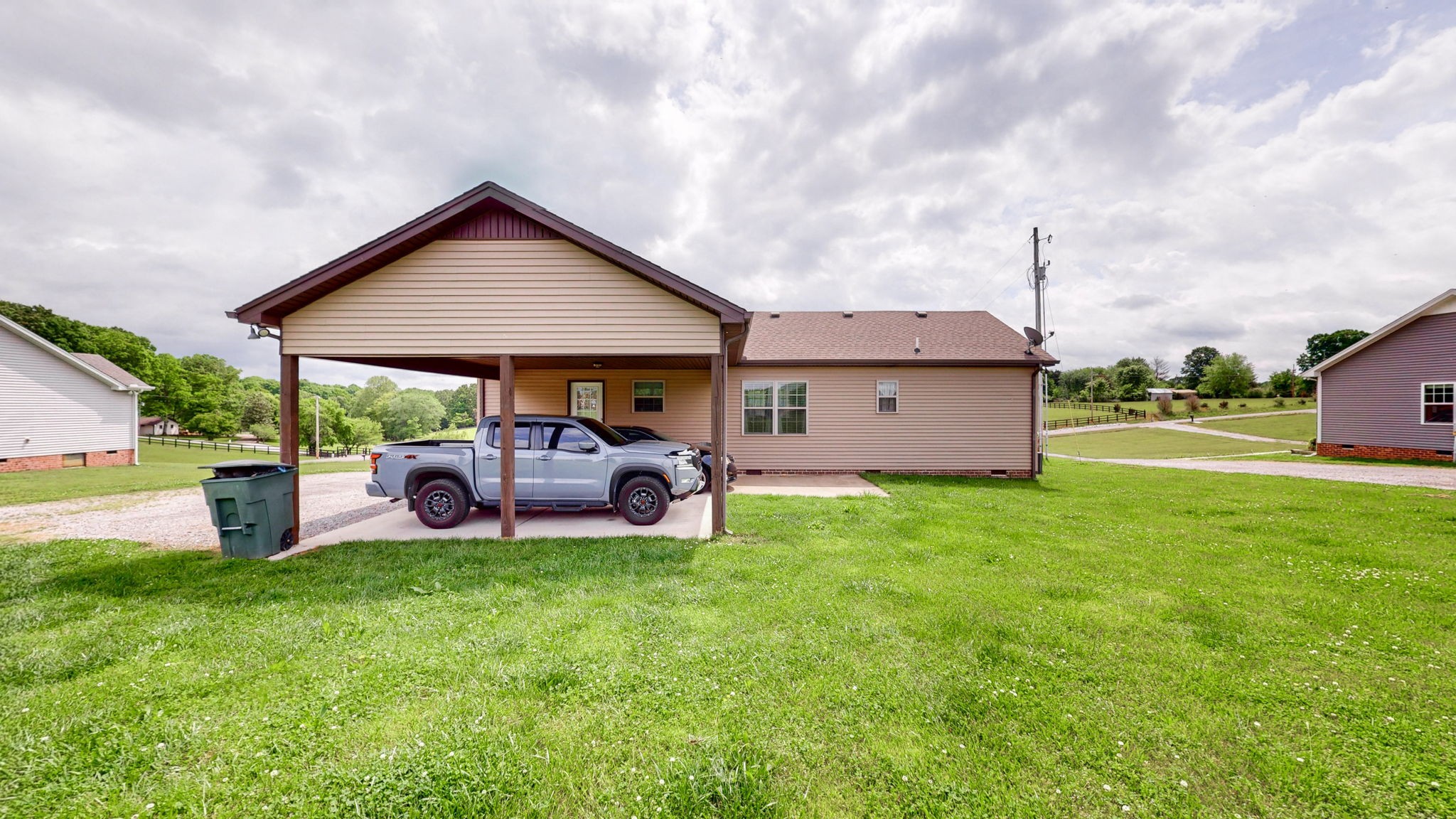 1462 East Ab Wade Road Portland, TN 37148 - Photo 2 of 52 a front view of house with yard and seating area