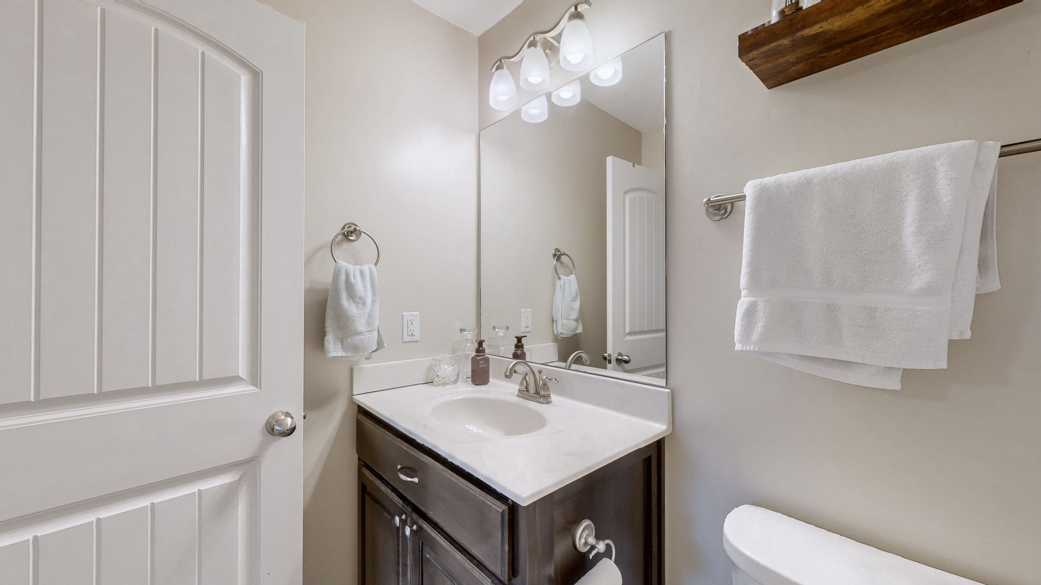 1462 East Ab Wade Road Portland, TN 37148 - Photo 21 of 52 a bathroom with a sink vanity mirror and toilet