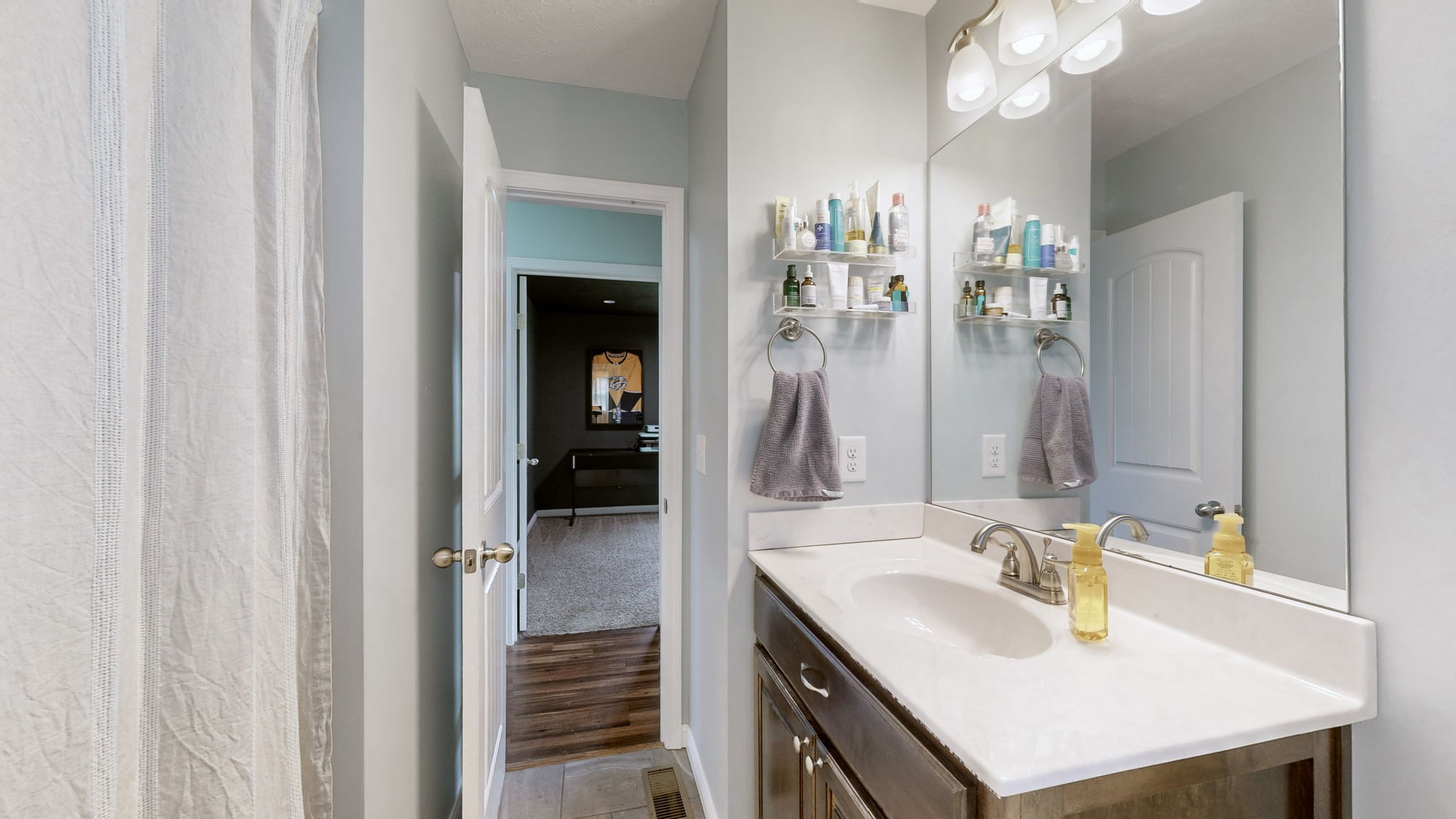 1462 East Ab Wade Road Portland, TN 37148 - Photo 26 of 52 a bathroom with a sink vanity and a mirror