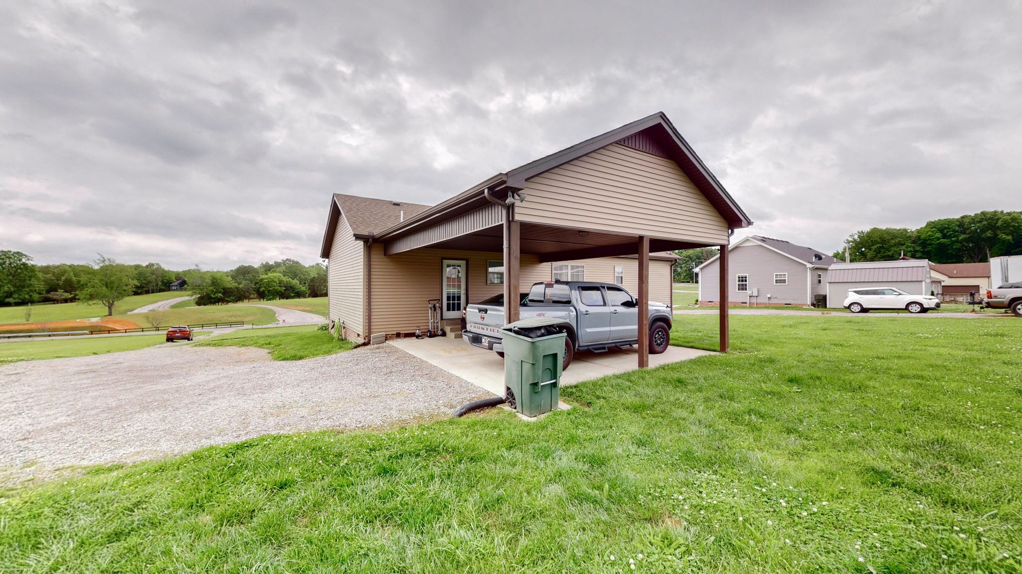 1462 East Ab Wade Road Portland, TN 37148 - Photo 31 of 52 a view of a house with backyard porch and garden