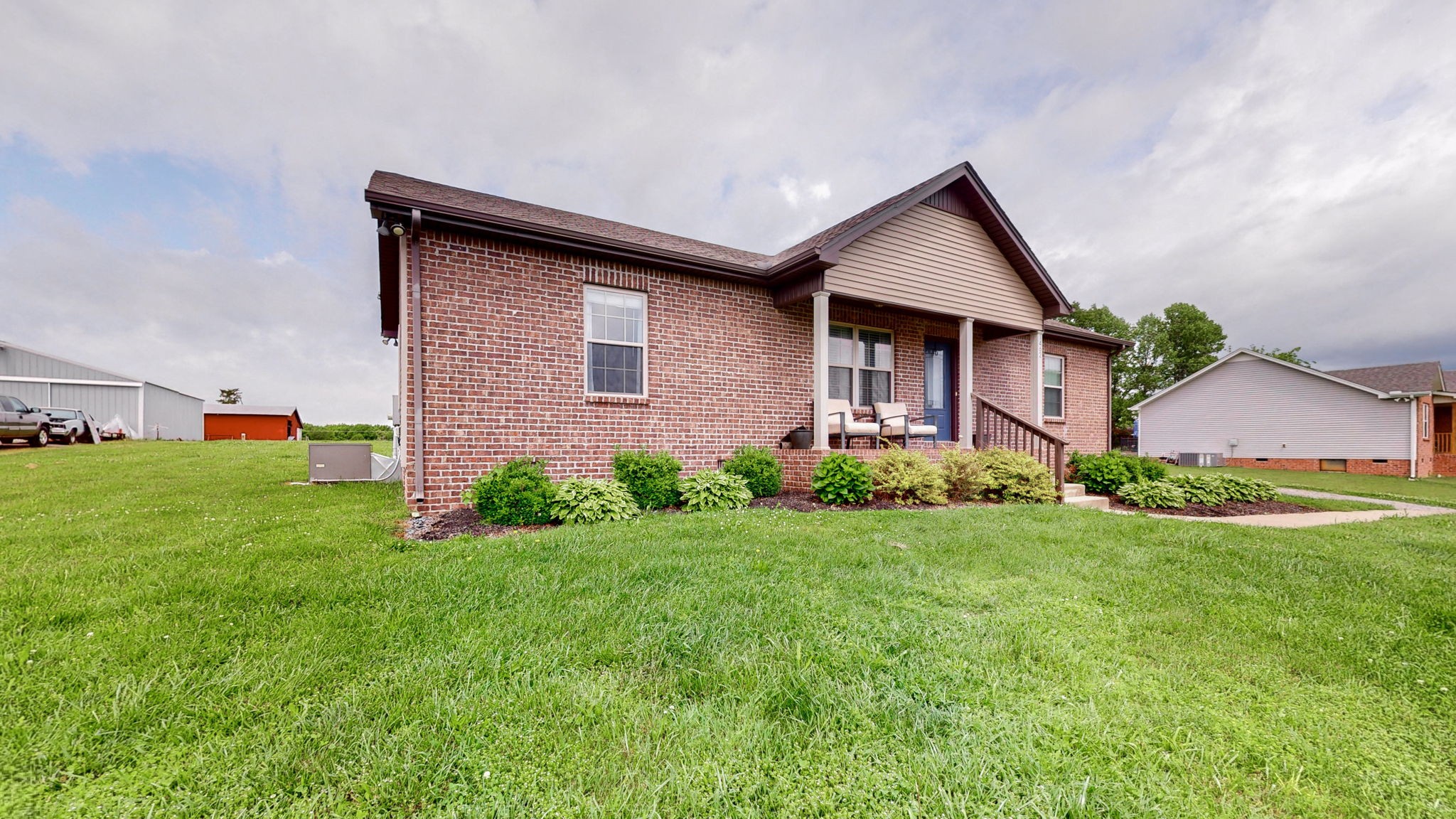 1462 East Ab Wade Road Portland, TN 37148 - Photo 38 of 52 a front view of house with yard and green space
