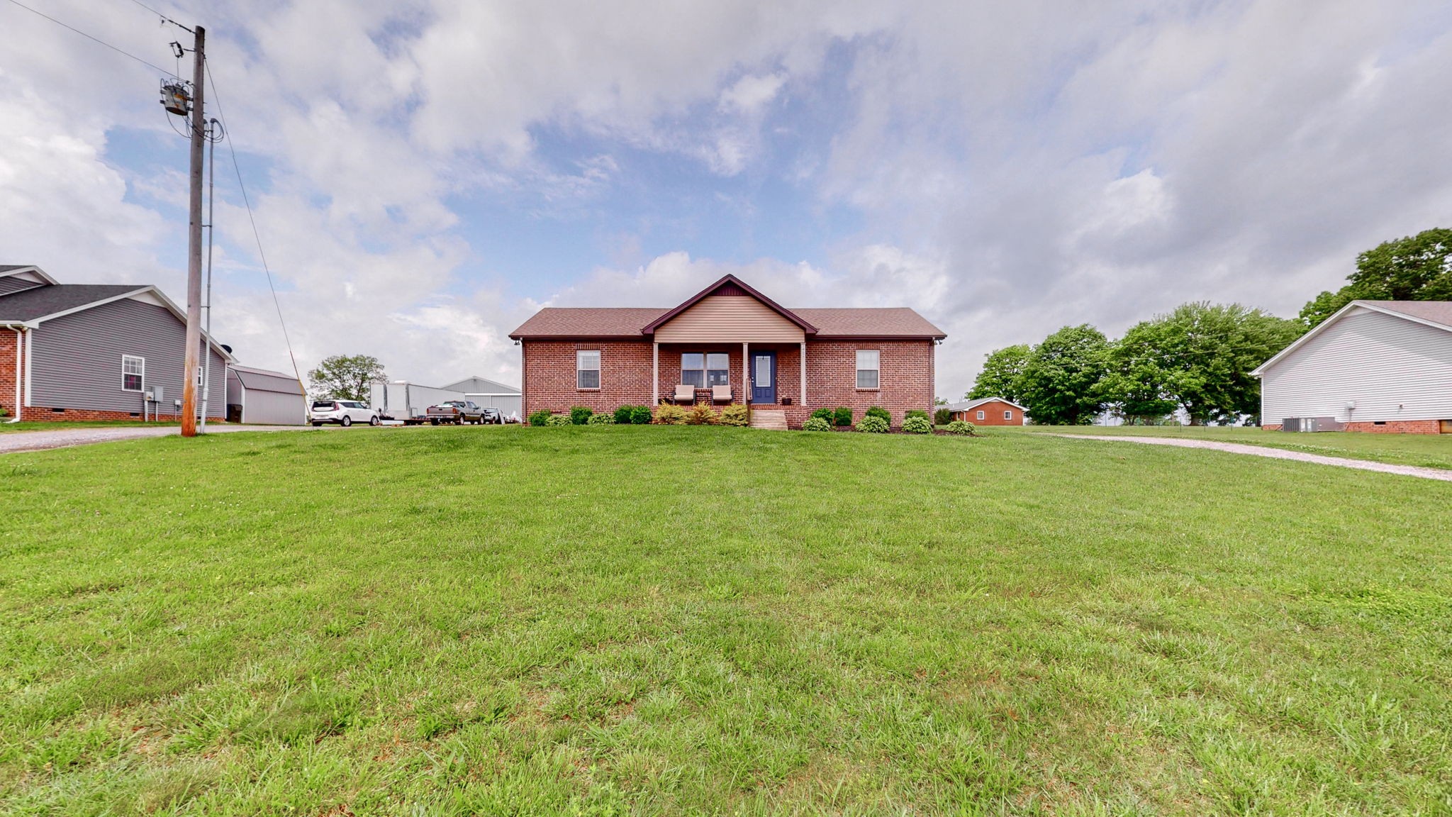 1462 East Ab Wade Road Portland, TN 37148 - Photo 40 of 52 a view of a house with a big yard and large trees