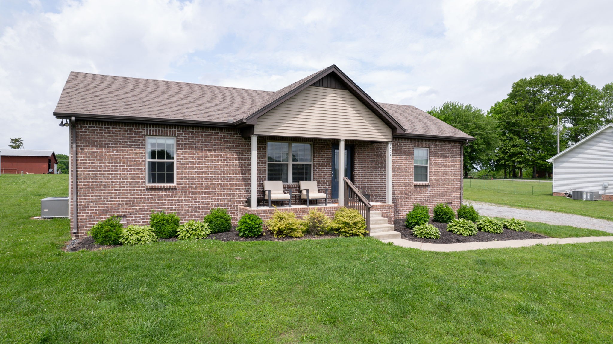 1462 East Ab Wade Road Portland, TN 37148 - Photo 44 of 52 a front view of a house with a garden