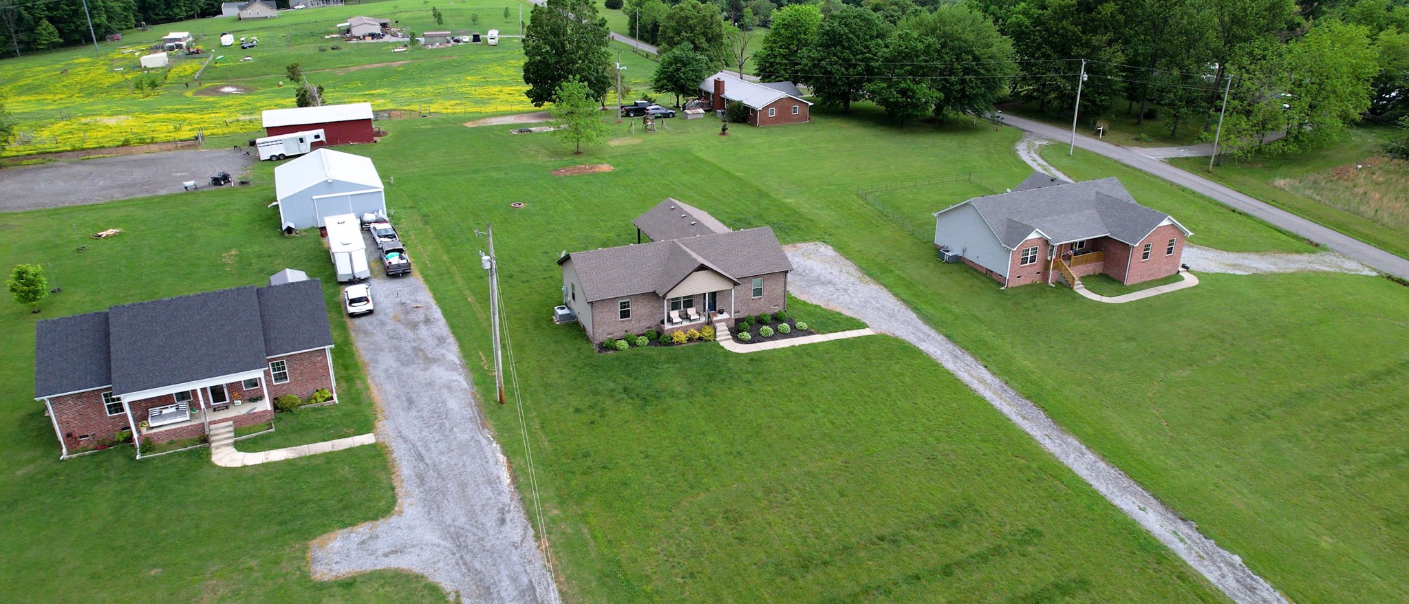 1462 East Ab Wade Road Portland, TN 37148 - Photo 45 of 52 an aerial view of a house with outdoor space pool lawn chairs and a yard