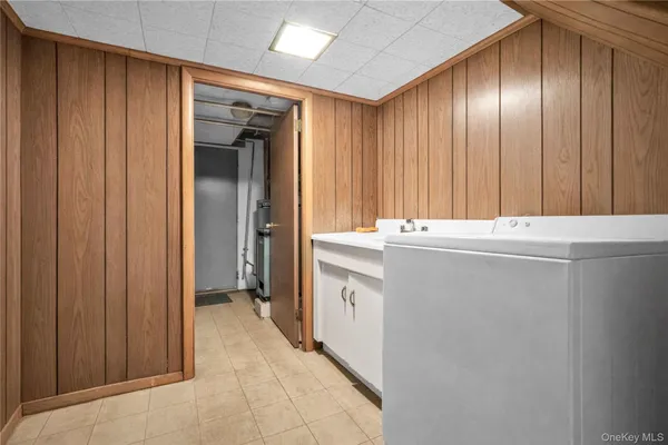 a room with a sink and cabinets