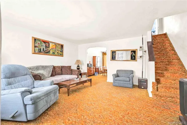 a living room with furniture and a couch